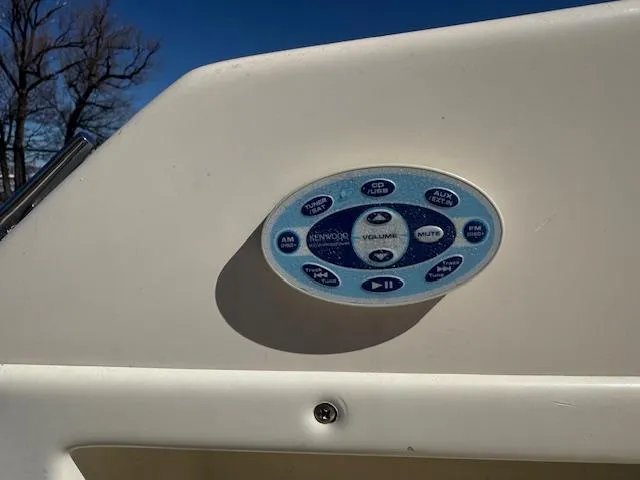 Slide: The Image of Control panel on 2003 Rinker 282 Captiva Cuddy boat, featuring audio system buttons. - 7