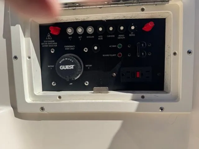 Slide: The Image of Control panel of 2003 Rinker 282 Captiva Cuddy boat with various switches and indicators. - 8
