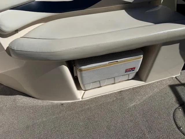 Slide: The Image of 2003 Rinker 282 Captiva Cuddy boat interior with built-in cooler storage. - 9