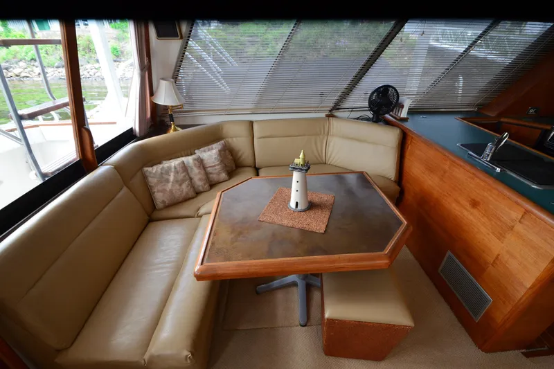 Slide: The Image of Interior of 1989 Bayliner 4518 Motoryacht with cozy seating and table. - 11