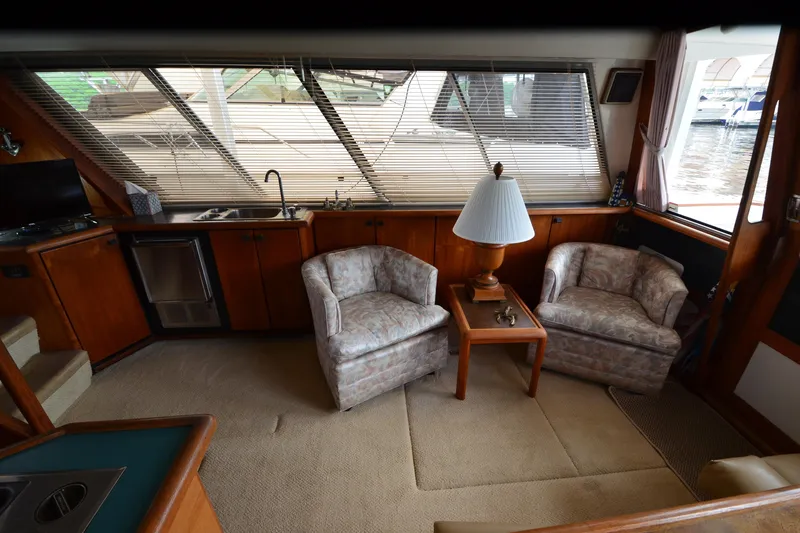 Slide: The Image of Interior of 1989 Bayliner 4518 Motoryacht with cozy seating and elegant decor. - 12