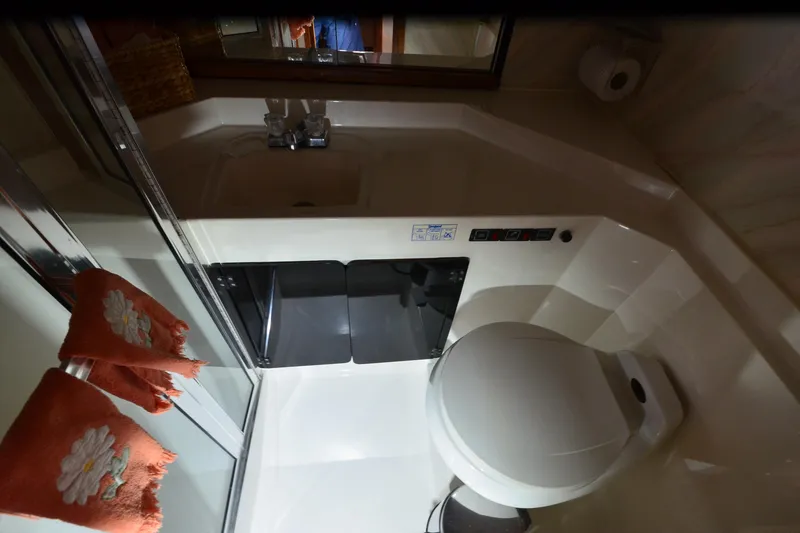 Slide: The Image of Bathroom interior of 1989 Bayliner 4518 Motoryacht with sink and toilet. - 18