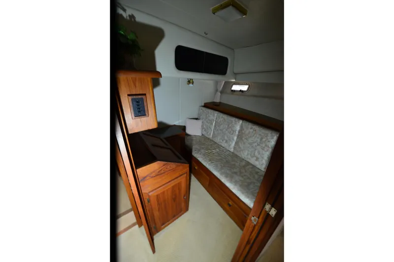 Slide: The Image of Interior of 1989 Bayliner 4518 Motoryacht with wooden cabinetry and cushioned seating. - 22
