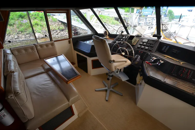 Slide: The Image of Interior of 1989 Bayliner 4518 Motoryacht with helm, seating, and control panel. - 29