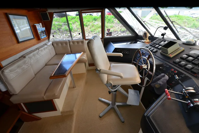 Slide: The Image of Interior of 1989 Bayliner 4518 Motoryacht with helm, seating, and navigation controls. - 31