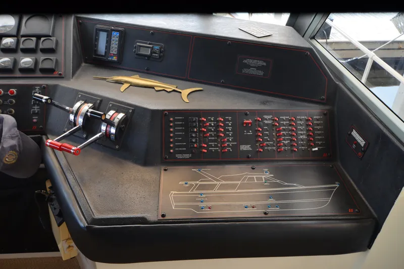 Slide: The Image of Control panel of a 1989 Bayliner 4518 Motoryacht with switches and throttle levers. - 34