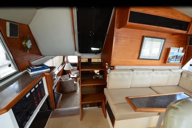 Slide: The Image of Interior of 1989 Bayliner 4518 Motoryacht with cozy seating and wooden accents. - 35