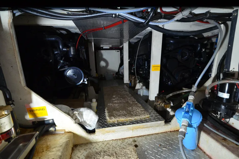 Slide: The Image of Engine room of 1989 Bayliner 4518 Motoryacht with visible machinery and wiring. - 36