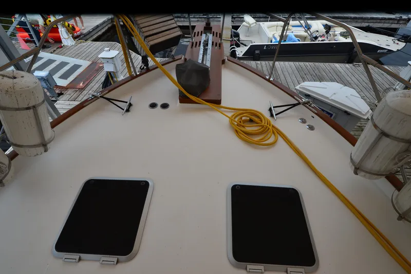 Slide: The Image of 1989 Bayliner 4518 Motoryacht deck with hatches, docked at marina. - 38