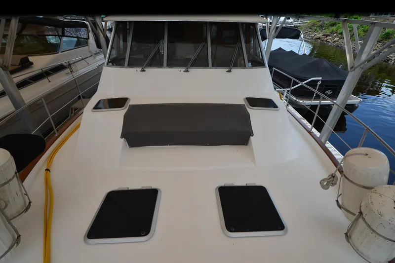 Slide: The Image of 1989 Bayliner 4518 Motoryacht docked, showcasing spacious deck and sleek design. - 40