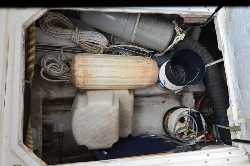 Slide: The Image of Storage compartment of 1989 Bayliner 4518 Motoryacht with ropes, fenders, and buckets. - 41
