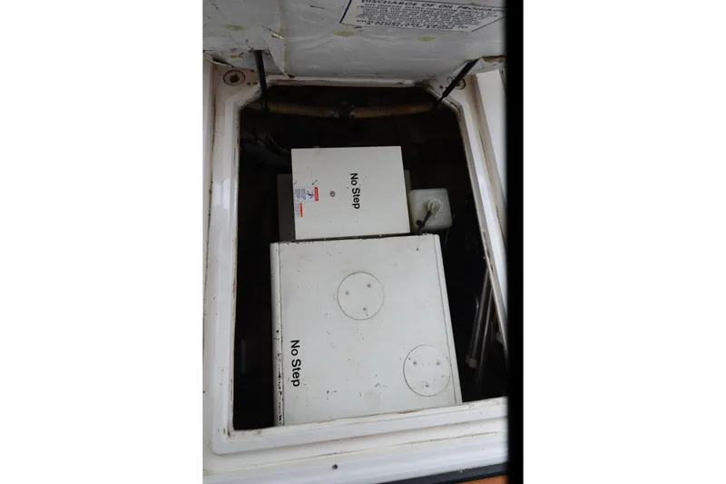 Slide: The Image of Engine compartment of 1989 Bayliner 4518 Motoryacht with "No Step" warning labels. - 42