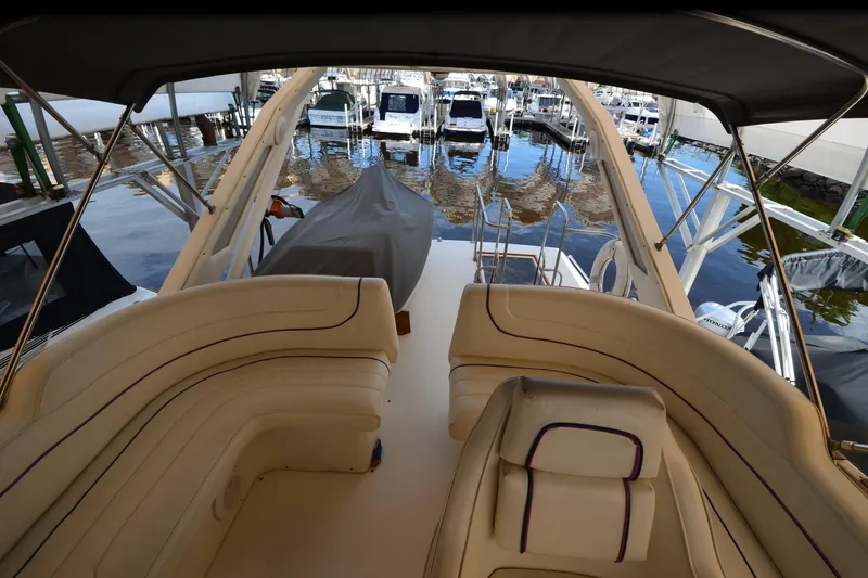 Slide: The Image of 1989 Bayliner 4518 Motoryacht interior with beige seating, docked at marina. - 44