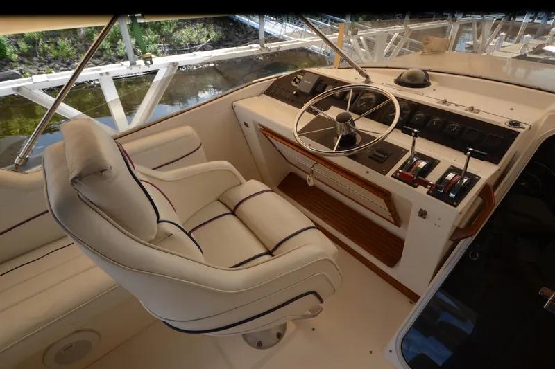 Slide: The Image of Captain's helm of 1989 Bayliner 4518 Motoryacht with steering wheel and controls. - 45
