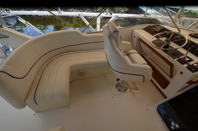 Slide: The Image of Interior of 1989 Bayliner 4518 Motoryacht with helm and seating area. - 47