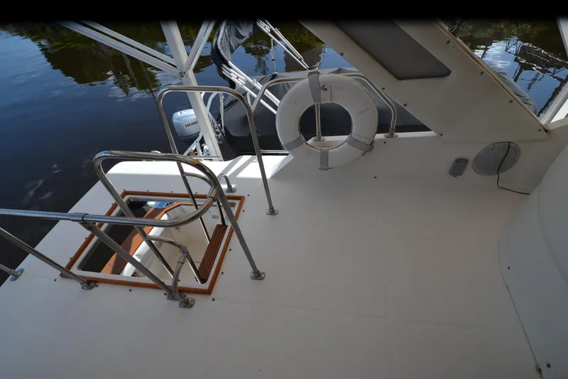 Slide: The Image of 1989 Bayliner 4518 Motoryacht deck with safety railings and life preserver. - 51
