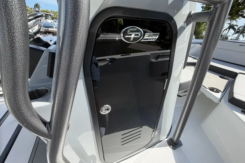Slide: The Image of 2026 Sea Pro 225FLX Sandbar boat interior with sleek black door and modern design elements. - 12