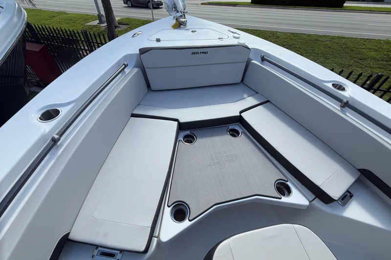 Slide: The Image of 2026 Sea Pro 225FLX Sandbar boat interior with cushioned seating and sleek design. - 26