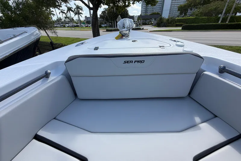 Slide: The Image of 2026 Sea Pro 225FLX Sandbar boat interior with cushioned seating and sleek design. - 28