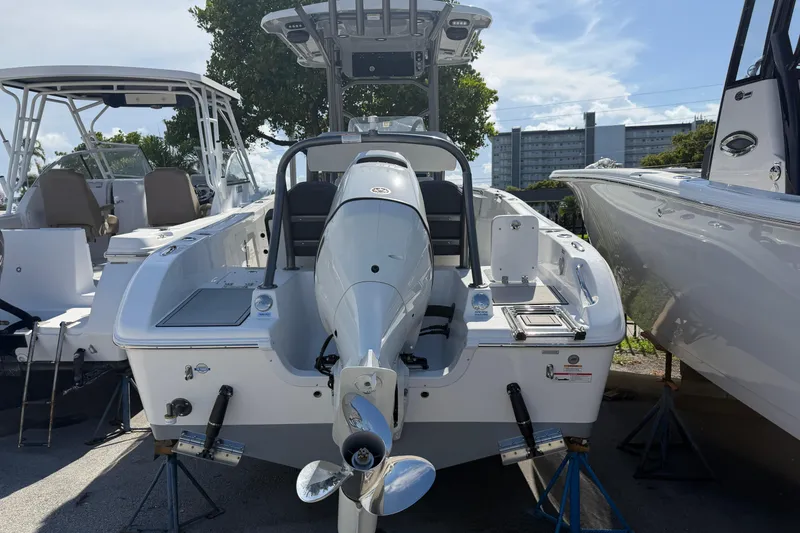 Slide: The Image of 2026 Sea Pro 225FLX Sandbar boat with outboard motor, displayed outdoors. - 3