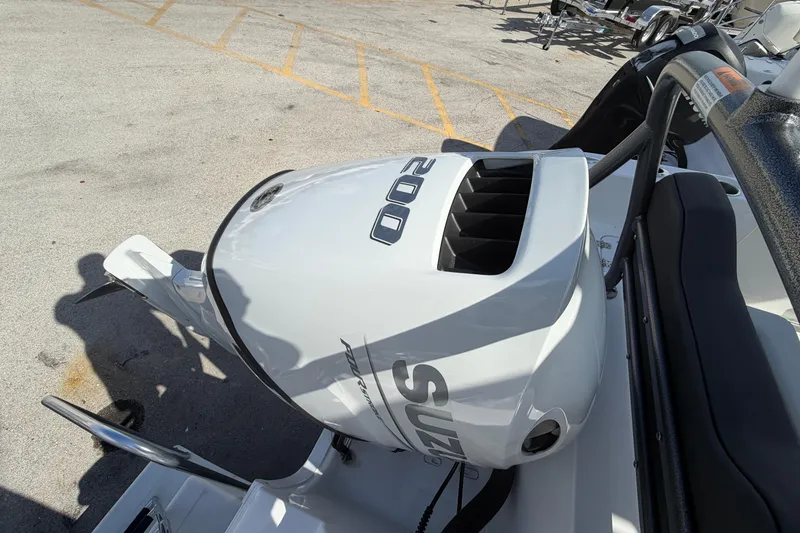 Slide: The Image of Outboard motor on 2026 Sea Pro 225FLX Sandbar boat, featuring Suzuki 200 horsepower engine. - 38