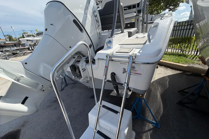 Slide: The Image of 2026 Sea Pro 225FLX Sandbar boat with ladder and outboard motor. - 39