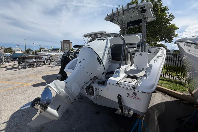 Slide: The Image of 2026 Sea Pro 225FLX Sandbar boat with powerful outboard motor in a marina setting. - 4