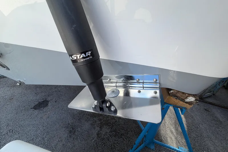 Slide: The Image of Trim tab and actuator on 2026 Sea Pro 225FLX Sandbar boat, showcasing marine hardware. - 40