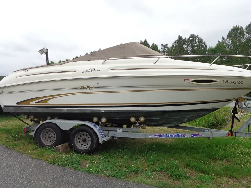 The Image of 1999 Sea Ray Express Cruiser on trailer, side view. - 1