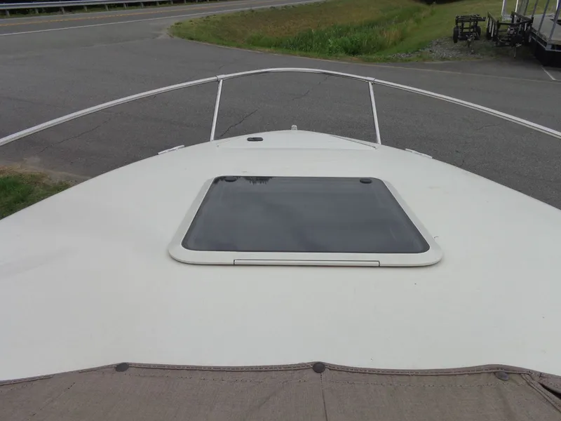 Slide: The Image of 1999 Sea Ray Express Cruiser bow view with deck hatch. - 14