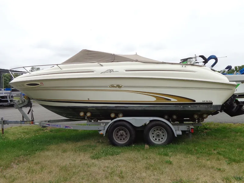 Slide: The Image of 1999 Sea Ray Express Cruiser on trailer, side view. - 2