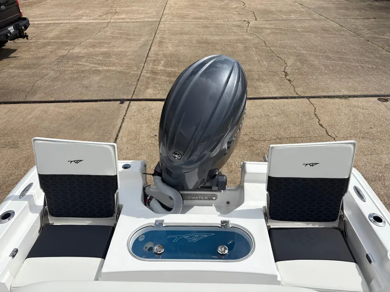 Slide: The Image of Rear view of 2026 Tidewater 2110 Bay Max with outboard motor. - 7