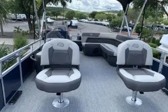 Slide: The Image of 2026 Sun Tracker Bass Buggy 16 XL Select pontoon boat with seating and open deck. - 6