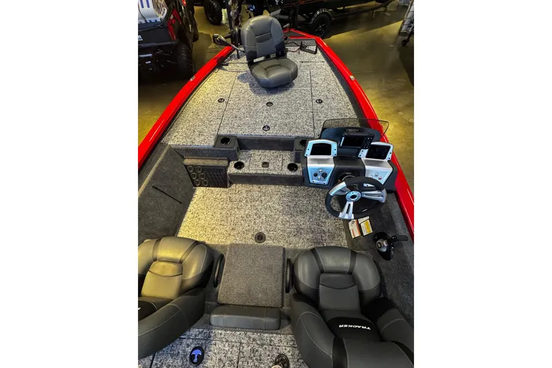 Slide: The Image of Interior view of 2026 Tracker Pro Team 195 boat with seating and control panel. - 5