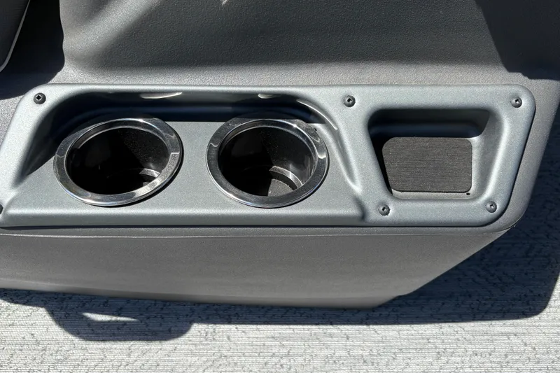 Slide: The Image of Cup holders and storage compartment on 2026 Sun Tracker Bass Buggy 18 DLX boat. - 19
