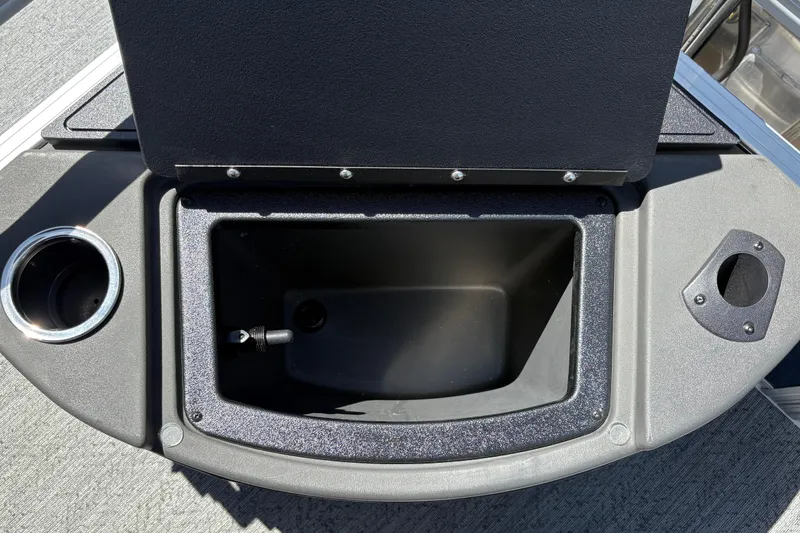 Slide: The Image of Open storage compartment on 2026 Sun Tracker Bass Buggy 18 DLX boat deck. - 27