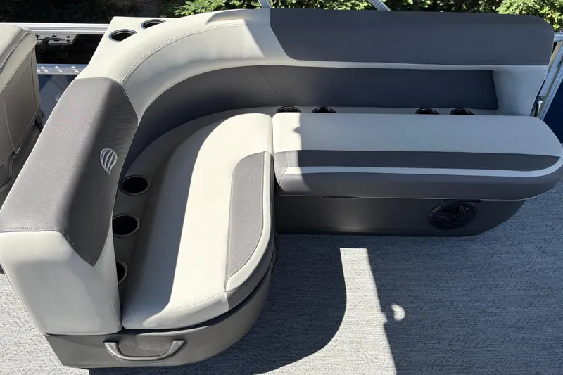 Slide: The Image of 2026 Sun Tracker Bass Buggy 18 DLX boat seating with cup holders, gray upholstery. - 17
