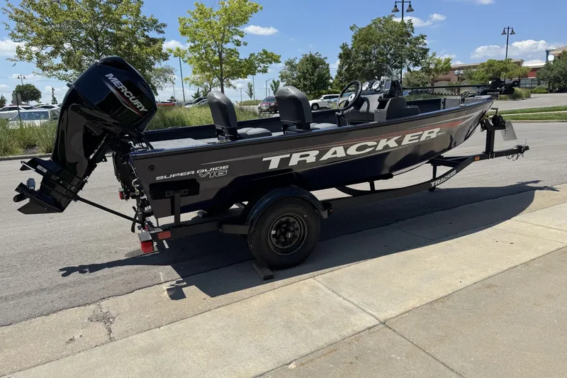 Slide: The Image of 2026 Tracker Super Guide V-16 SC boat on trailer, parked outdoors. - 53