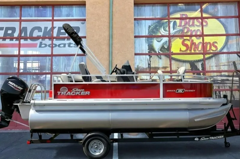The Image of 2026 Sun Tracker Bass Buggy 16 XL Select pontoon boat displayed at Bass Pro Shops. - 0