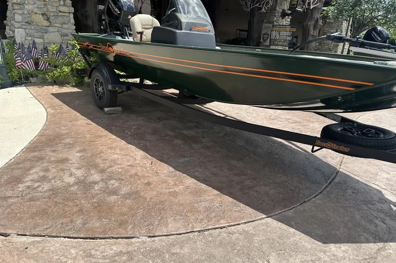 Slide: The Image of 2026 Tracker Bass Tracker Classic Limited boat on trailer, parked on a driveway. - 4