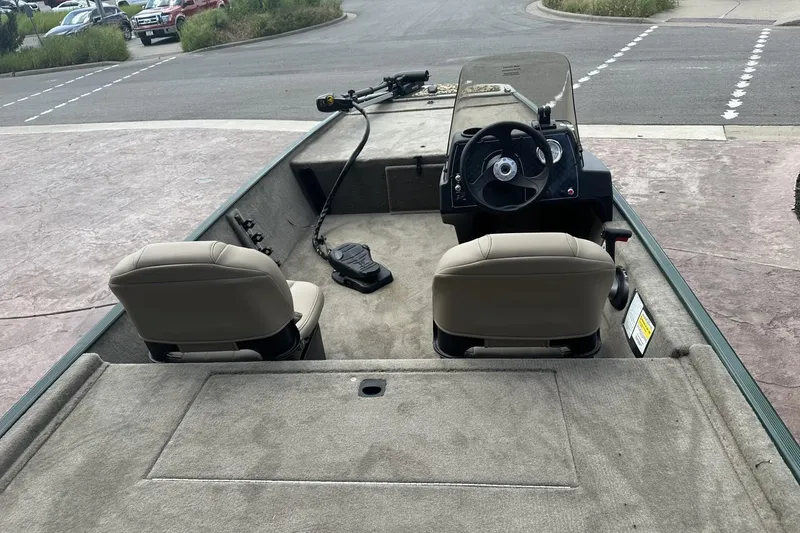 Slide: The Image of 2026 Tracker Bass Tracker Classic Limited boat interior with steering console and seating. - 10
