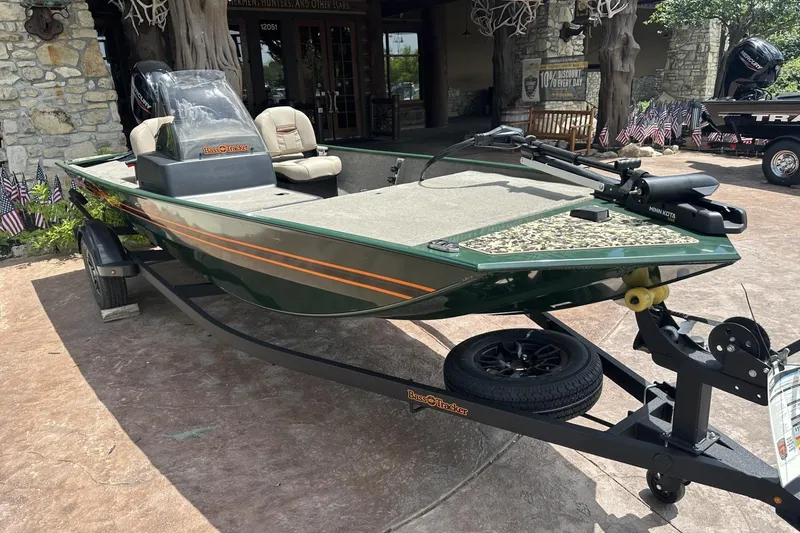 Slide: The Image of 2026 Tracker Bass Tracker Classic Limited boat on trailer, parked outdoors. - 5
