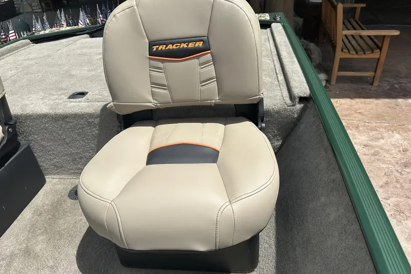 Slide: The Image of 2026 Tracker Bass Tracker Classic Limited boat seat, beige with orange accents. - 9