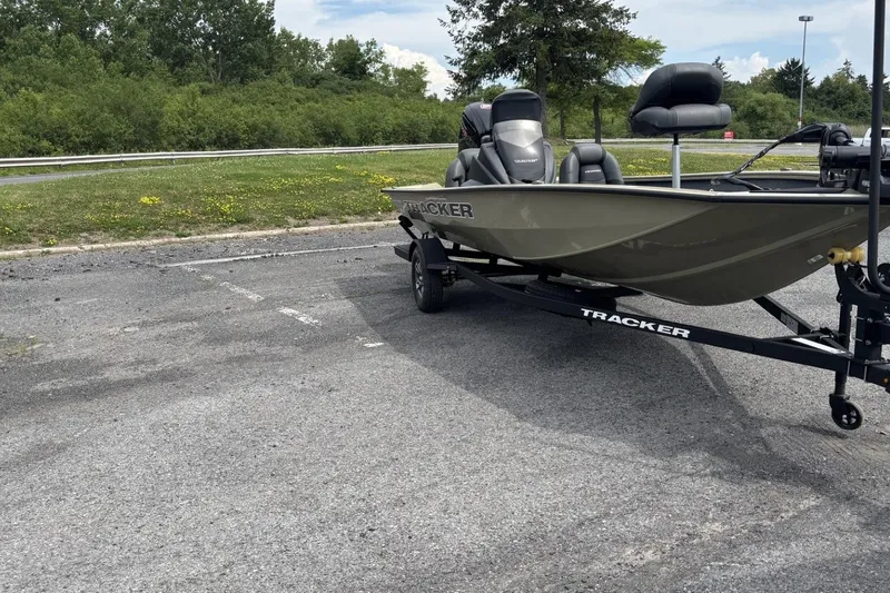Slide: The Image of 2026 Tracker Pro Team 190 boat on trailer in parking lot. - 4