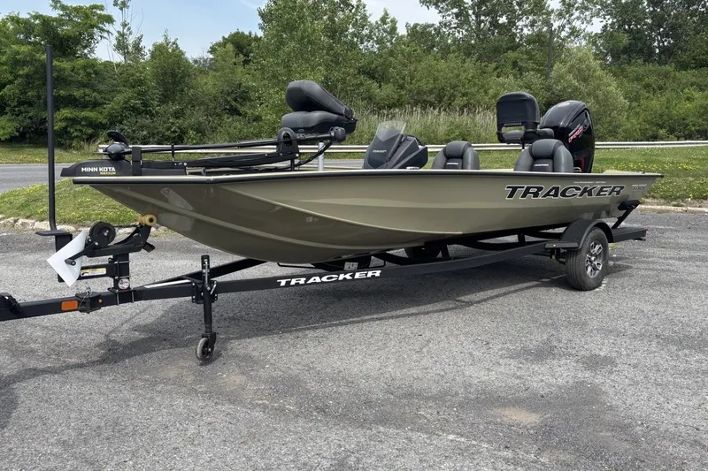 Slide: The Image of 2026 Tracker Pro Team 190 fishing boat on trailer, parked outdoors. - 53