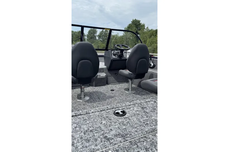 Slide: The Image of 2026 Tracker Pro Guide V-175 WT boat interior with seating and steering console. - 5