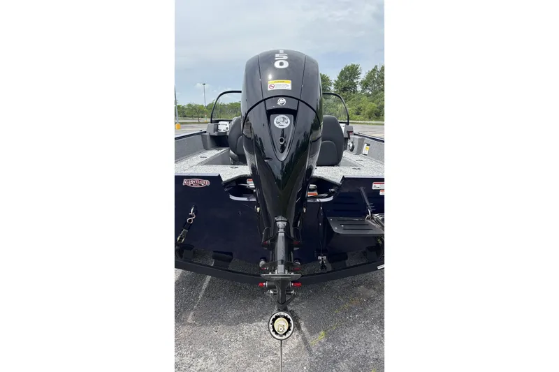 Slide: The Image of 2026 Tracker Pro Guide V-175 WT boat with powerful outboard motor, parked outdoors. - 6