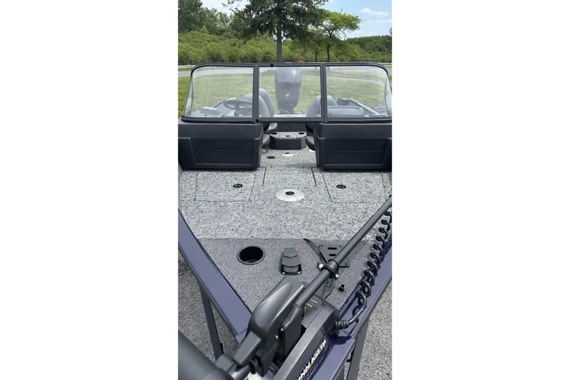 Slide: The Image of 2026 Tracker Pro Guide V-175 WT boat interior with windshield and fishing deck. - 2