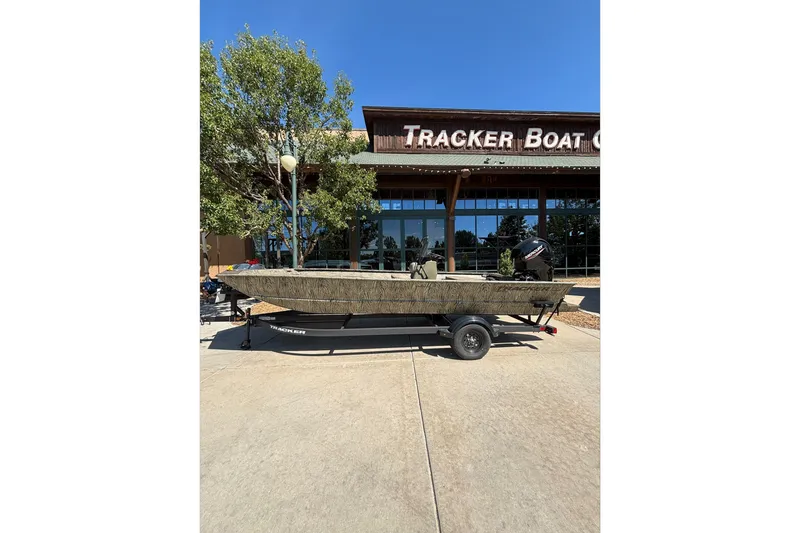 The Image of 2026 Tracker Grizzly 2072 CC boat on trailer outside Tracker Boat Center. - 0