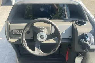 Slide: The Image of Steering console of 2026 Sun Tracker Party Barge 18 DLX pontoon boat. - 6